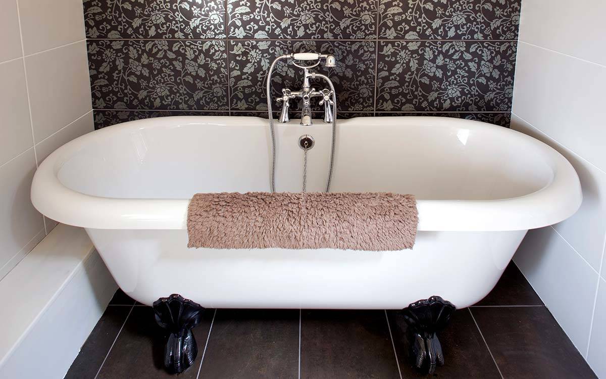 Morton House roll top bath in loft bathroom